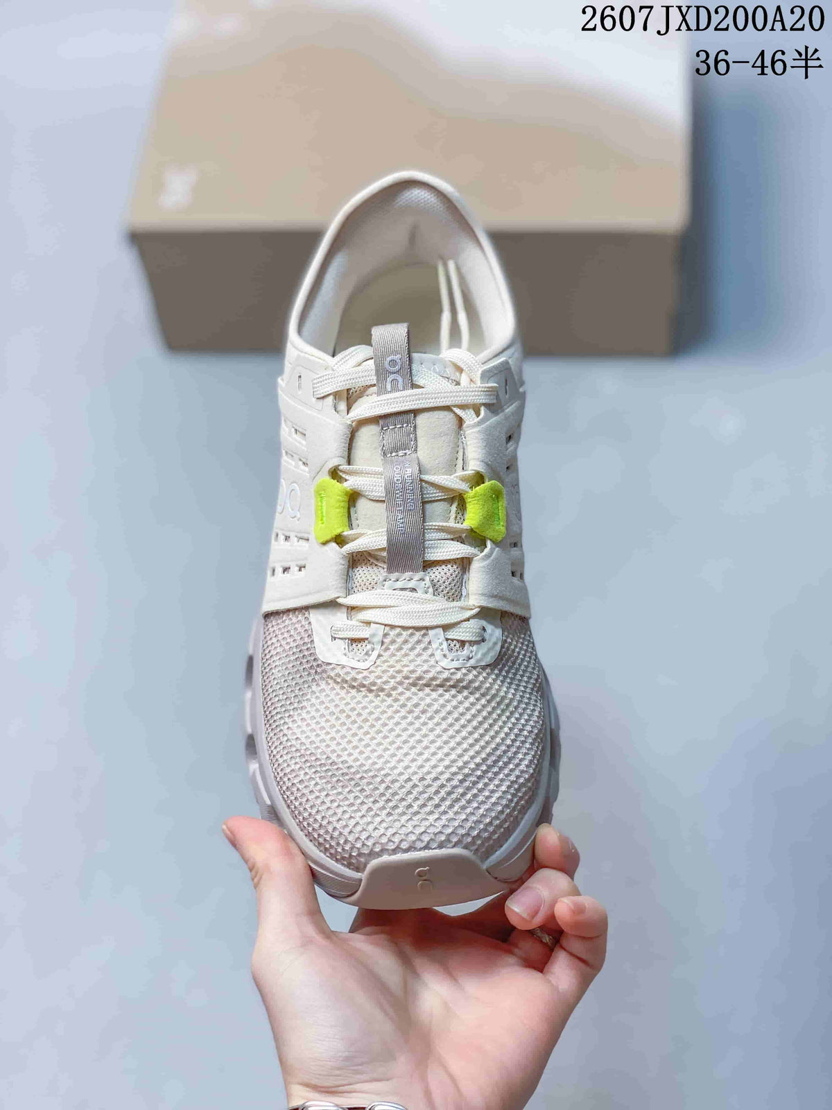 Top-down view showing the mesh toe box, laces, tongue, and neon yellow lace accents.
