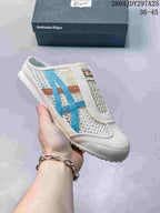 White Onitsuka Tiger Mexico 66 Sabot slip-on sneaker with bright blue and brown contrasting stripes.