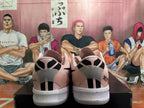 Rear view of pink Nike sneakers showing black heel details and white textured soles.