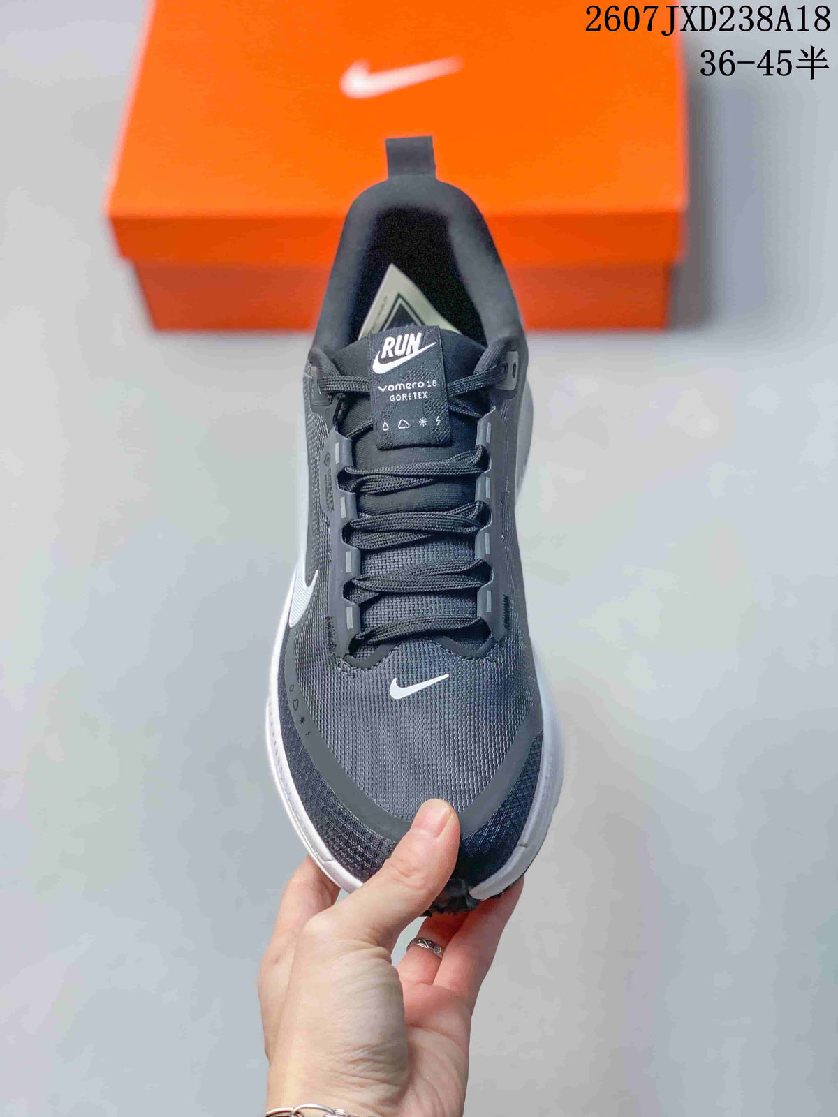 Top view showing the lace-up design, padded tongue, Nike Swoosh, and Vomero 18 GORE-TEX text.