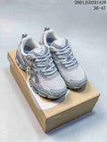 Pair of gray ASICS GEL-NYC RGD sneakers displayed on a shoebox, with the size range 36–47 visible in the upper right.