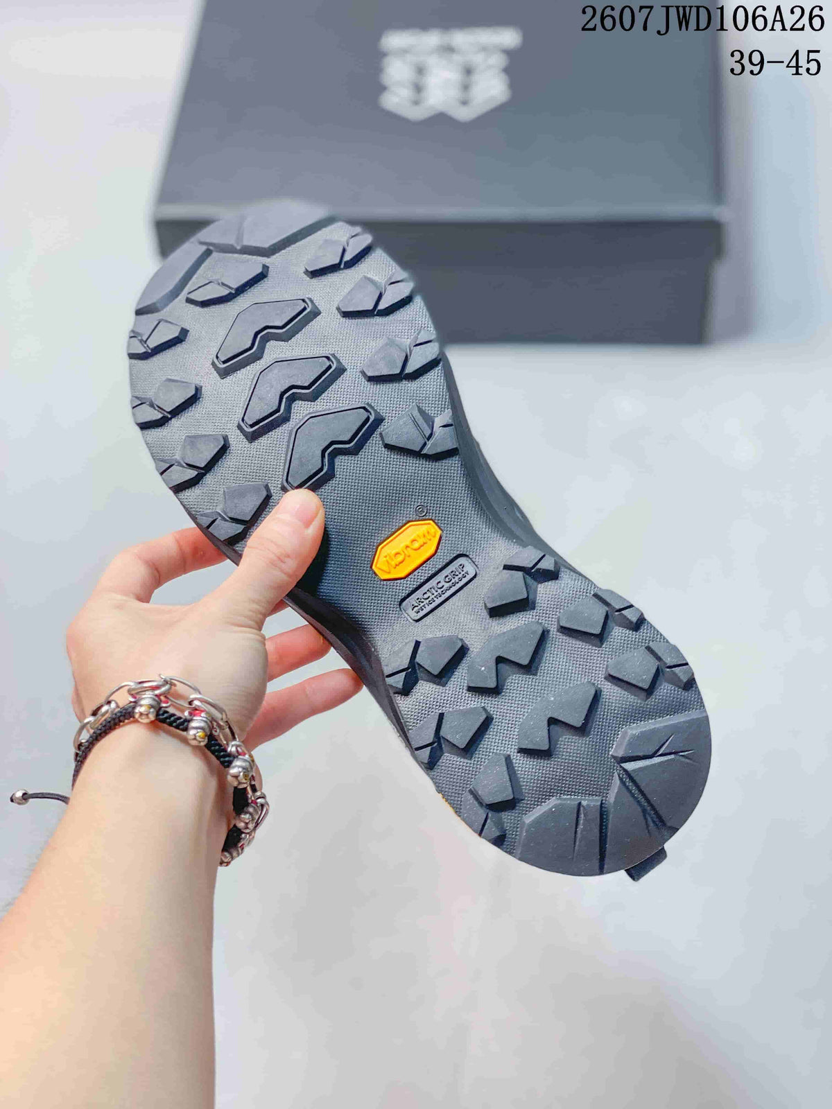 Close view of the lugged outsole showing angular tread blocks and visible Vibram branding.