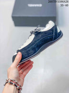 Side profile of a black and white low-top sneaker with contrasting panels and a slim outsole.