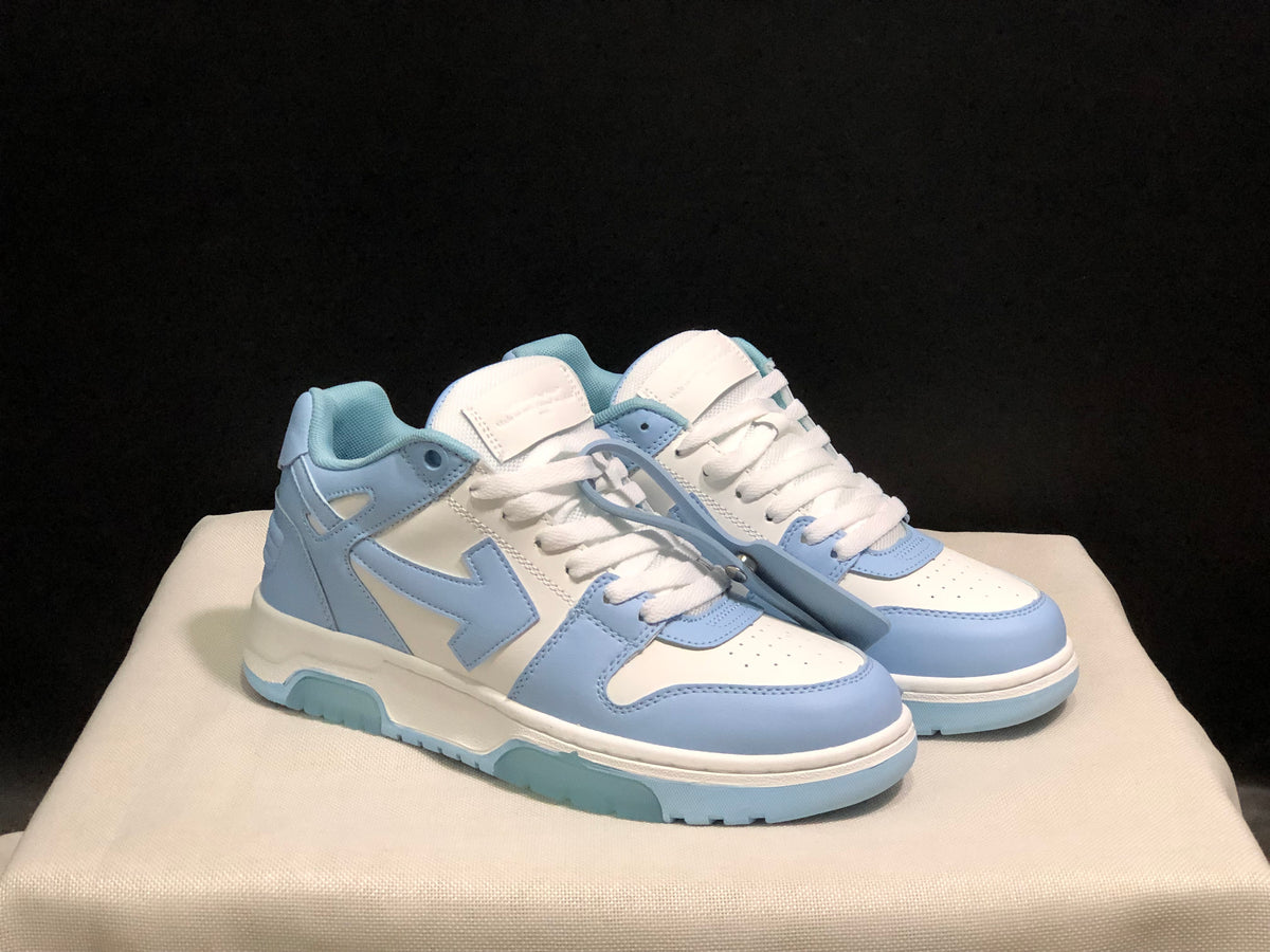 Front three-quarter view of the pair highlighting the perforated toe panels and detachable blue tag.