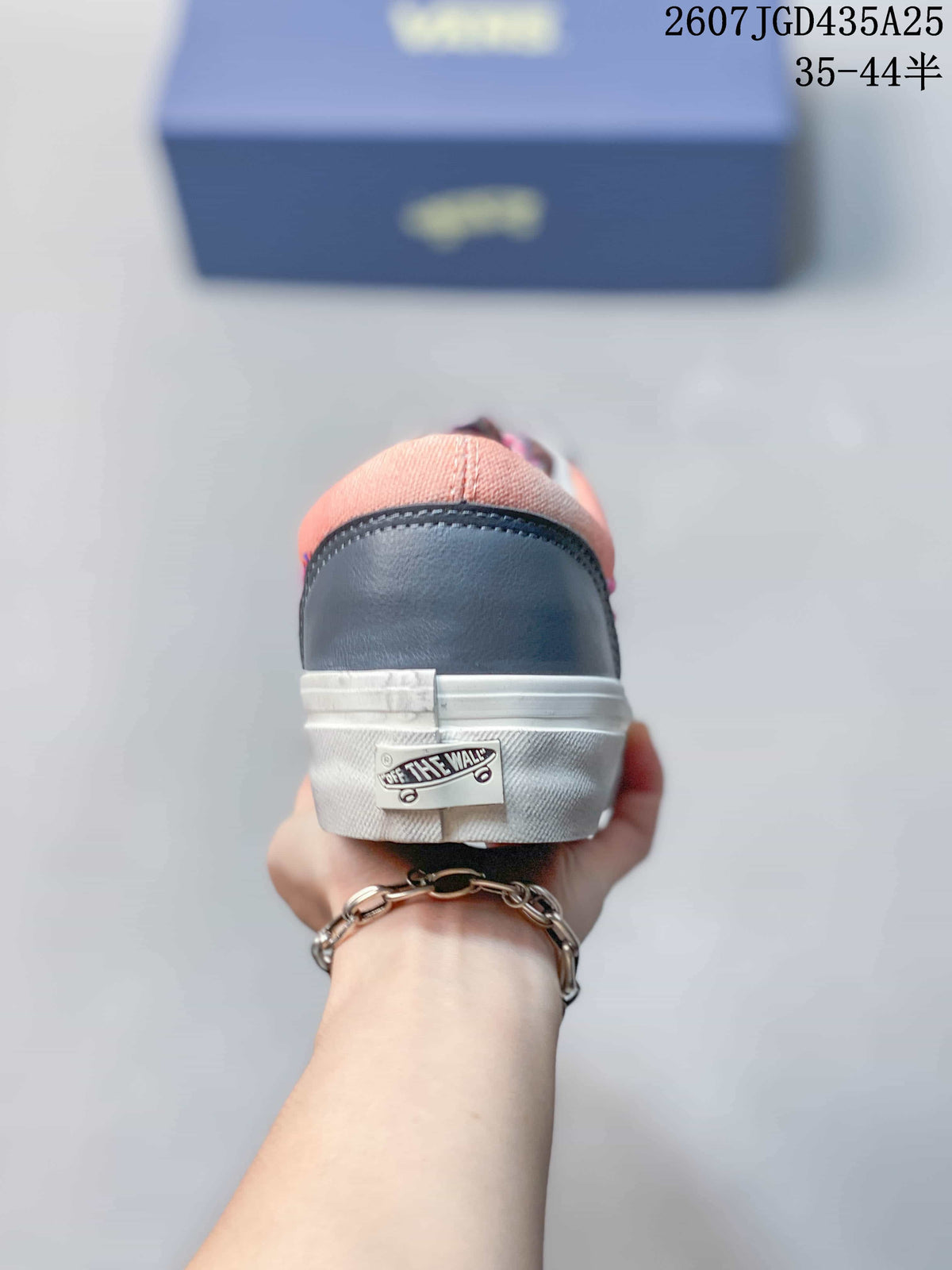 Rear view showing the navy heel panel and Vans heel label