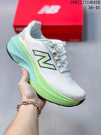 White New Balance running sneaker with a neon green and aqua midsole and pale green side branding.