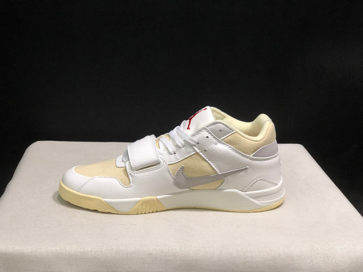 Side profile showing the white upper, grey Swoosh, cream paneling, midfoot strap and cream outsole.