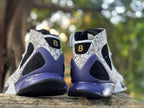 Rear view highlighting the purple-blue heel structure and patterned ankle overlays