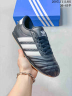 Angled view of the sneaker showing its white side stripes and quilted toe