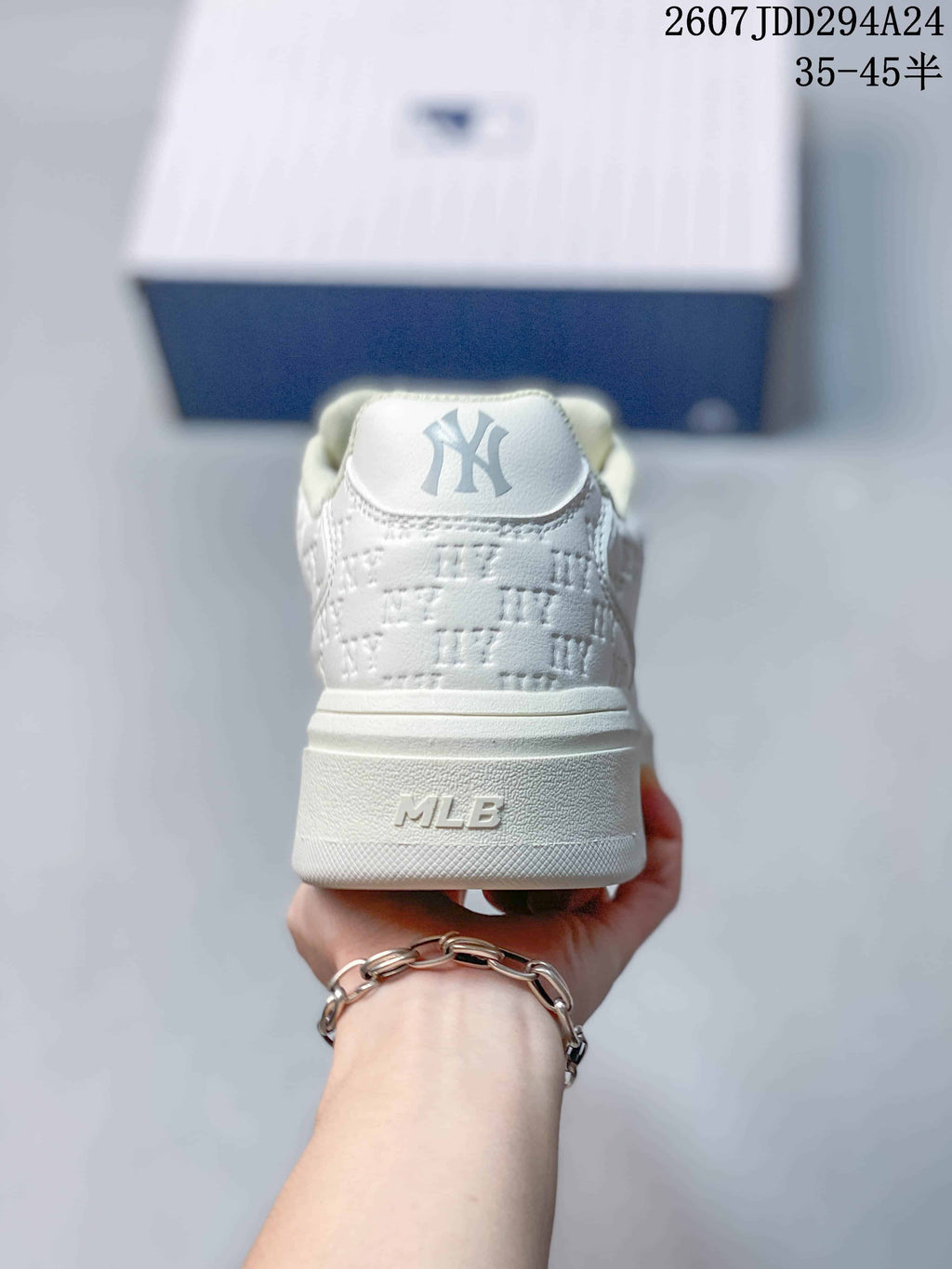 Rear view of the white sneaker showing the MLB heel branding, padded collar and raised platform sole.