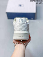 Rear view of the white sneaker showing the MLB heel branding, padded collar and raised platform sole.