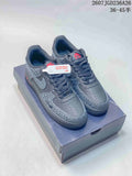 Pair of dark gray low-top sneakers shown on a shoebox, with patterned overlays, red accents, and a visible source size range marking.
