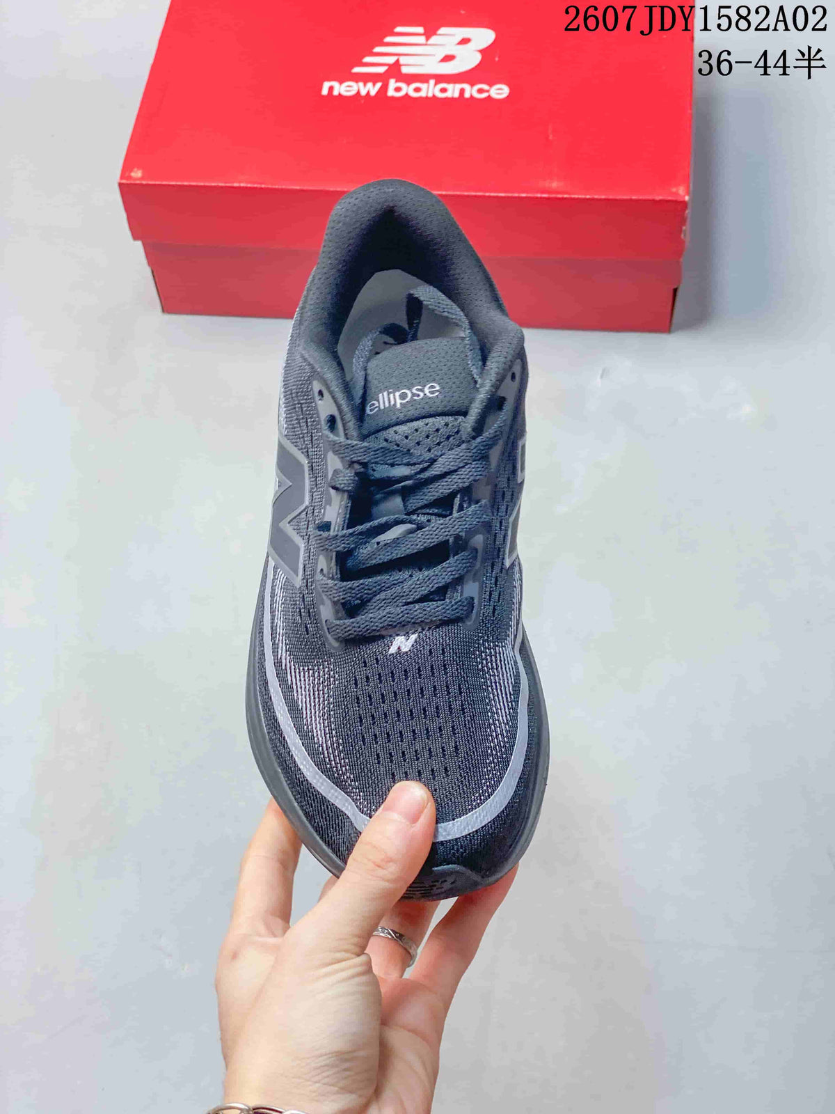 Top view of a dark gray New Balance running shoe with lace-up closure