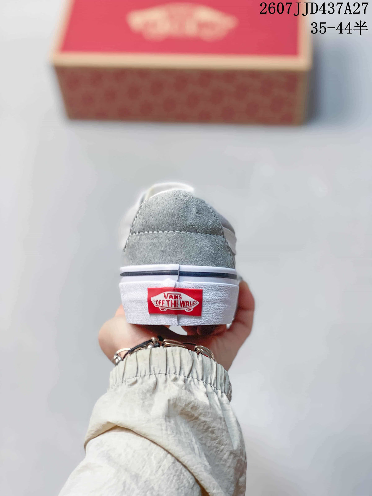 Rear view of the grey sneaker showing the white sole and red Vans heel label.