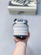 Rear view showing the padded heel, Nike branding, layered stitching, and dark outsole edge.