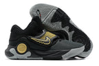 Black Nike KD basketball shoes with gold accents and a gray outsole.