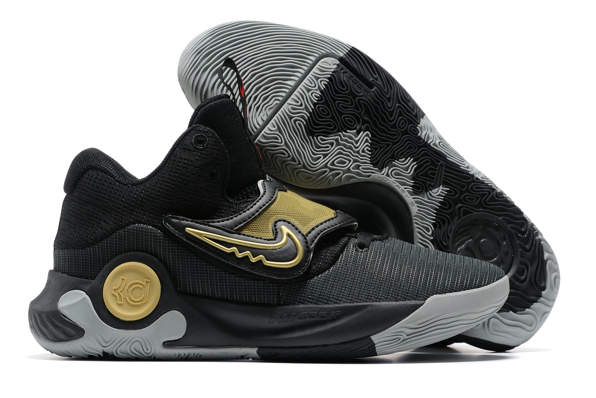 Black Nike KD basketball shoes with gold accents and a gray outsole.