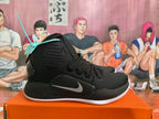 Side view of a black Nike Hyperdunk shoe with a silver Swoosh