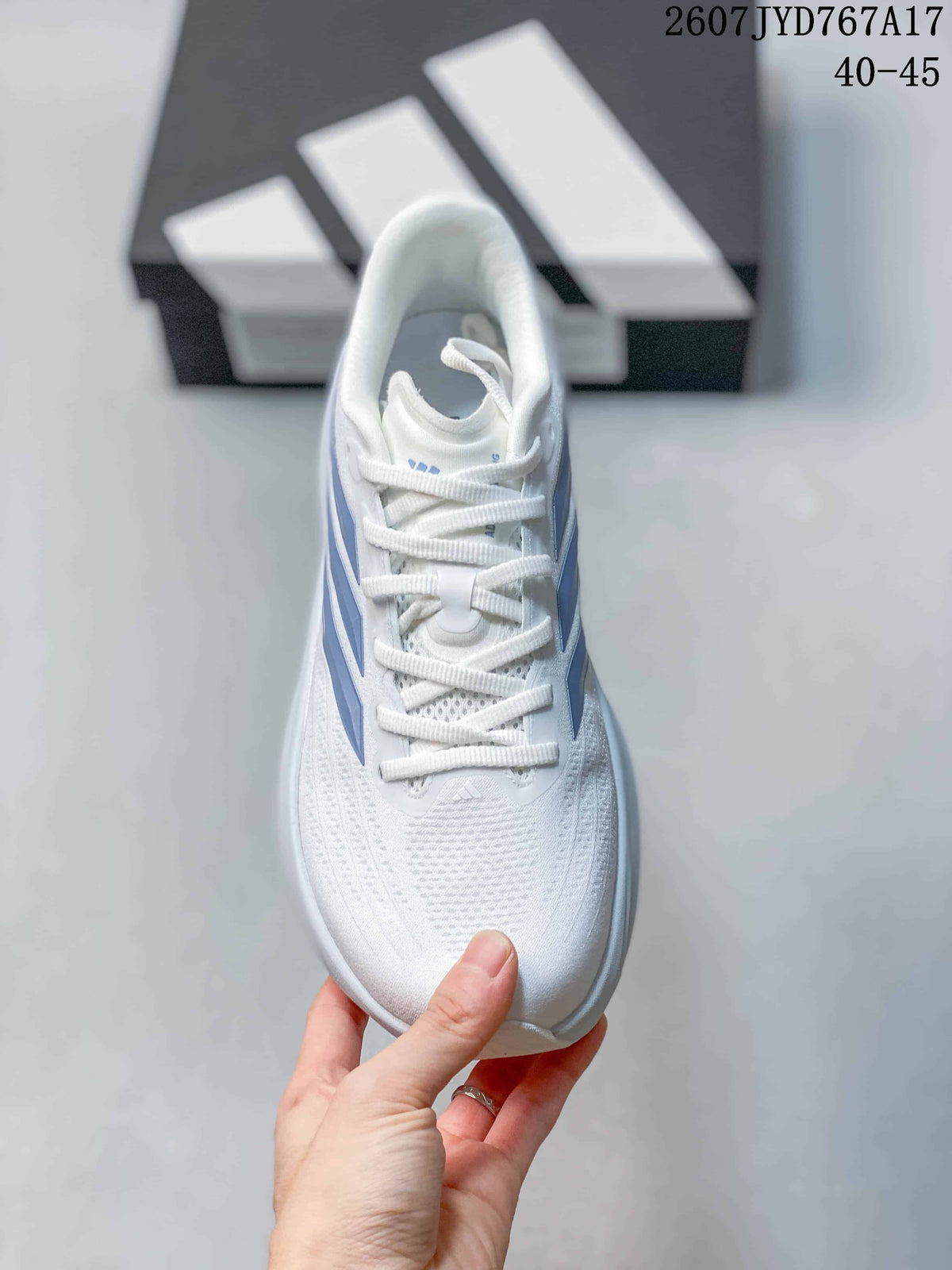 Top view of the white sneaker showing the lace-up closure, textured upper and blue side accents.