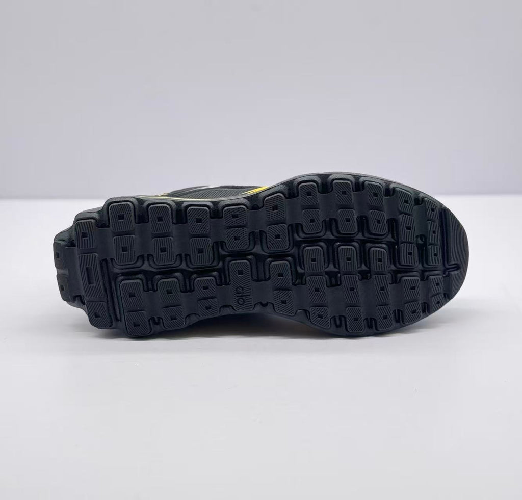 Underside view showing the black outsole with a raised block-pattern tread.