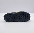Underside view showing the black outsole with a raised block-pattern tread.