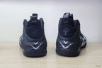 Rear view of black high-top sneakers with white V-shaped heel graphics