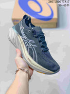 Dark navy ASICS Gel-Nimbus 26 sneaker with a light sculpted midsole and contrasting outsole accents.