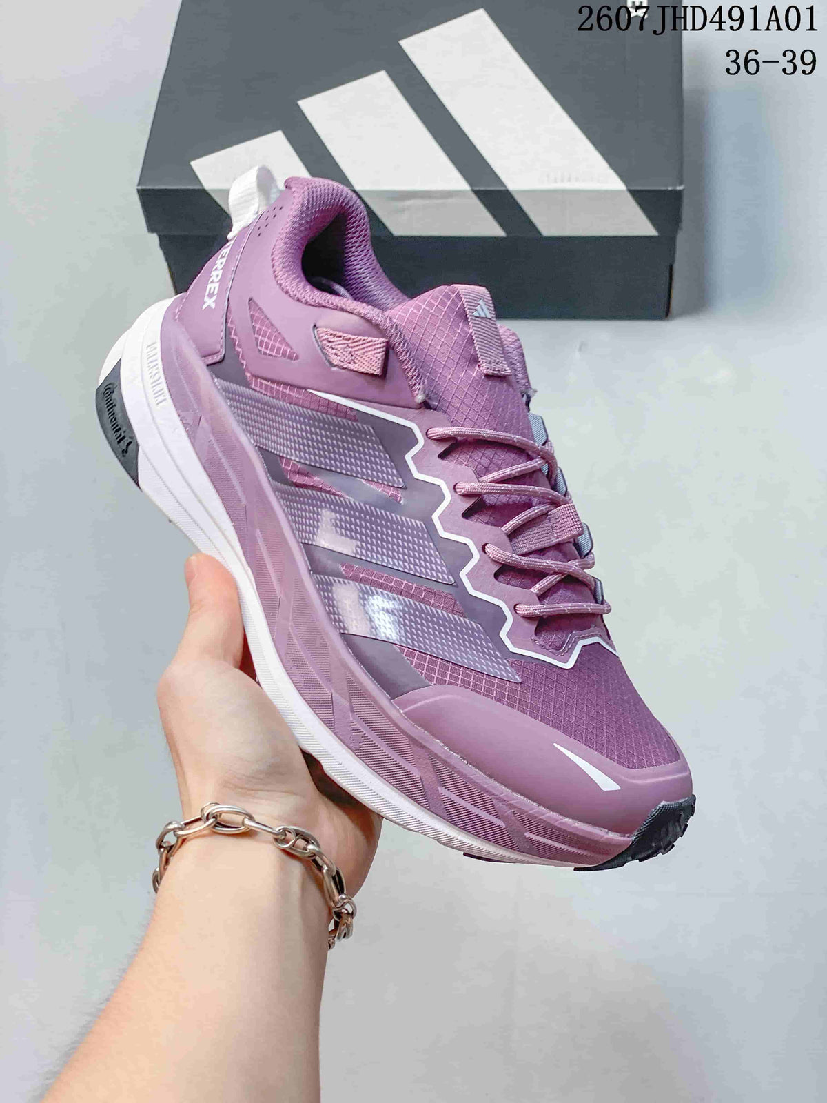 Angled side view of the purple Terrex sneaker