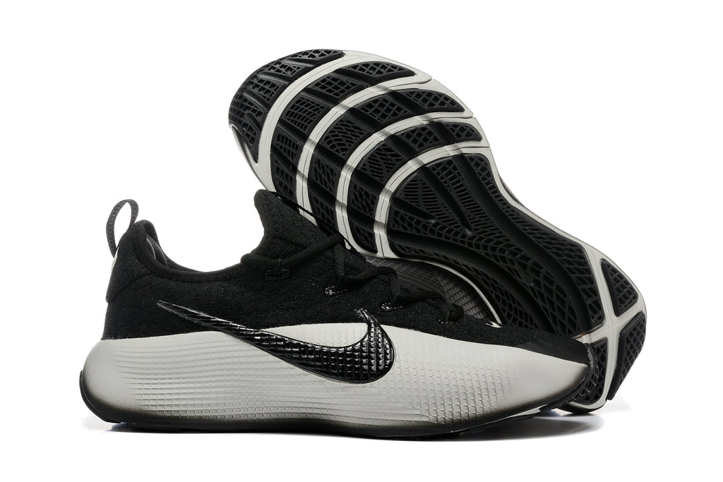 Training shoe side view with the outsole exposed, showing its tread pattern.