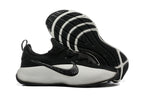 Training shoe side view with the outsole exposed, showing its tread pattern.