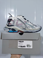 Balenciaga Runner sneaker in white, grey and blue with pink accents, displayed on its shoebox with a visible EU 40 label.