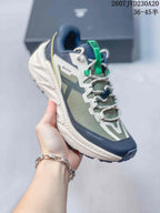 Angled side view highlighting the low-top profile, layered upper, cushioned-looking midsole and lugged outsole.