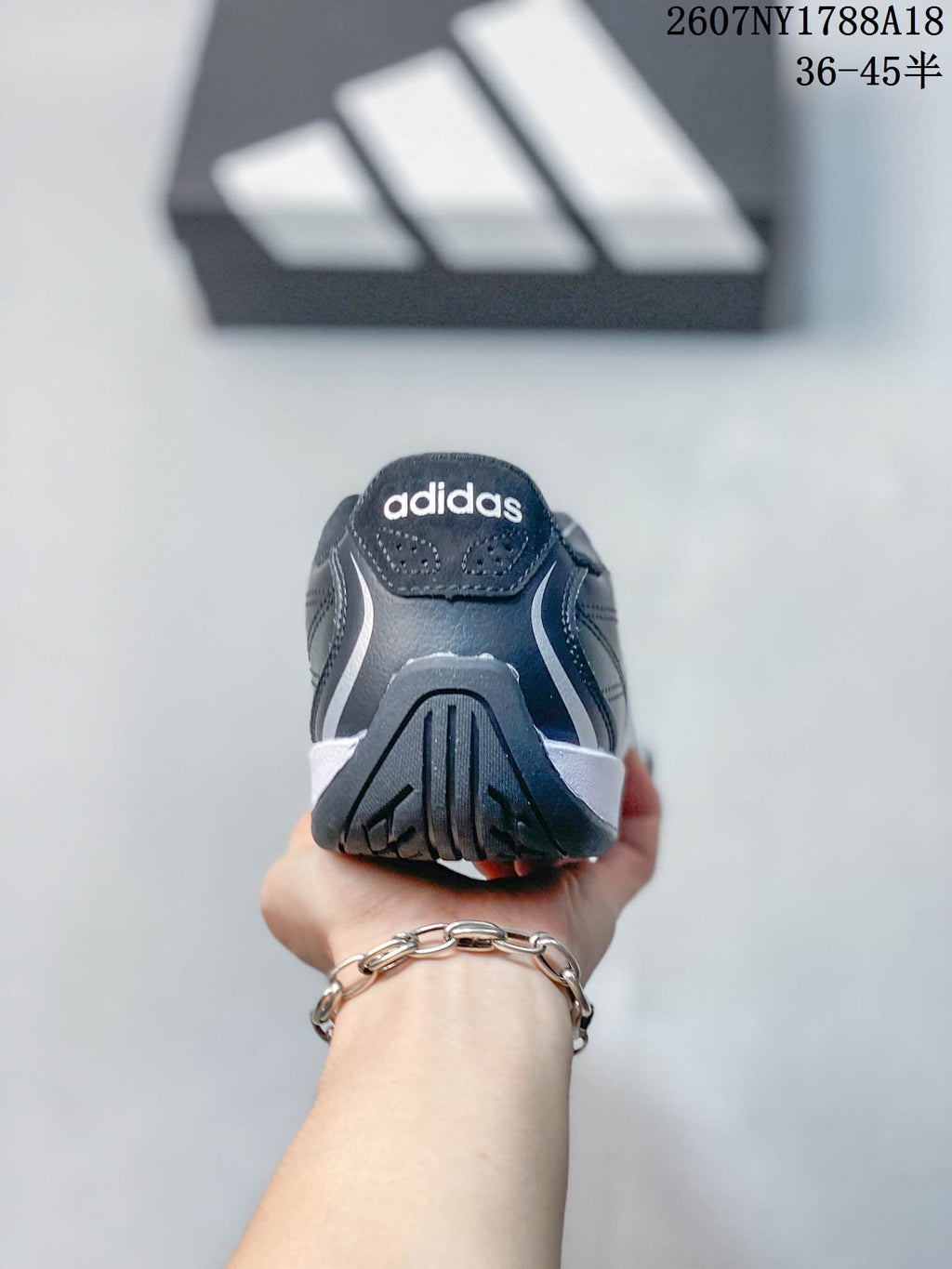 Rear view showing the padded heel and adidas branding on the tongue.