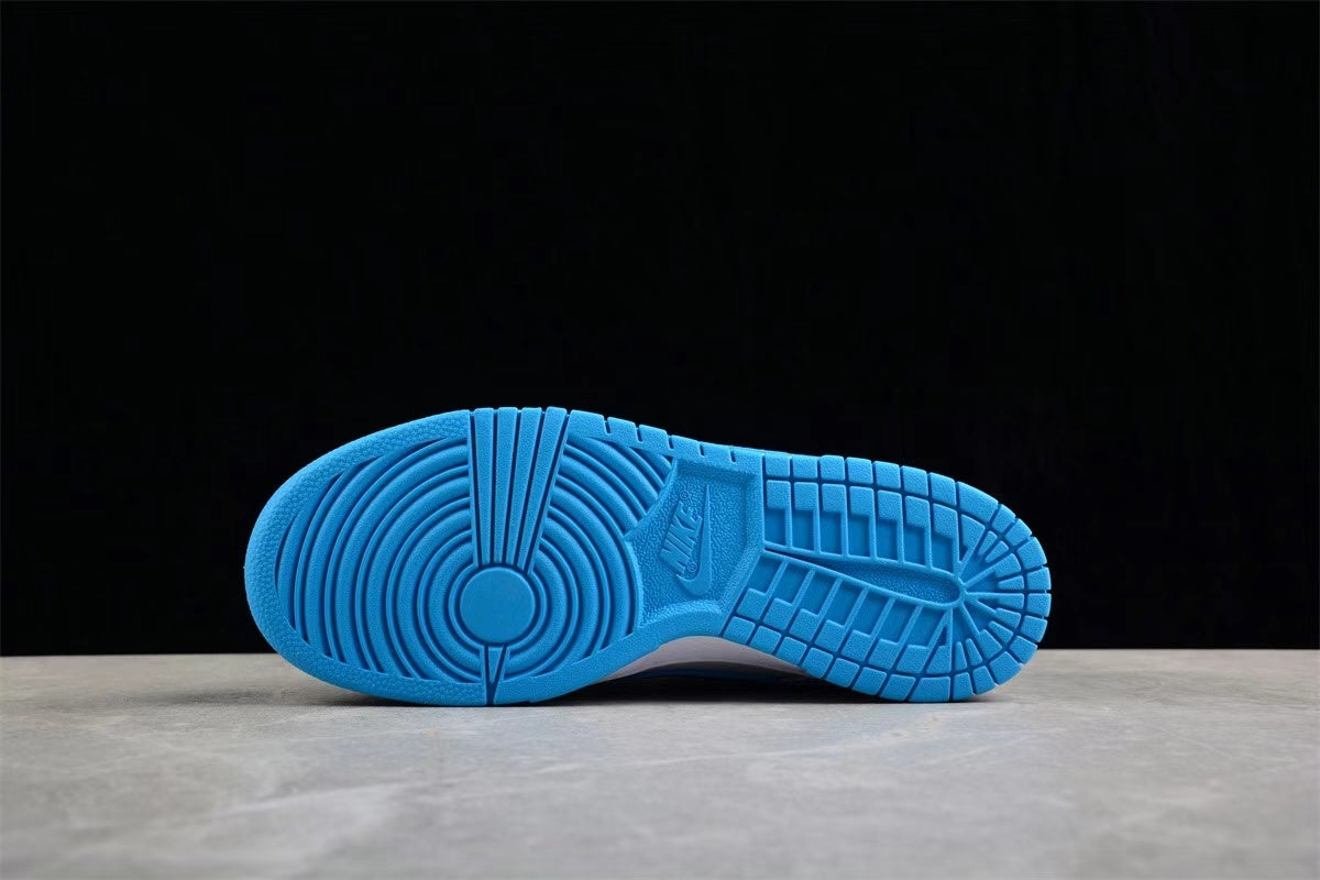 Bottom view of the bright blue rubber outsole showing circular forefoot traction and segmented tread.