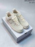 Pair of cream Nike Air Force 1 '07 LV8 low-top sneakers displayed on a shoebox.