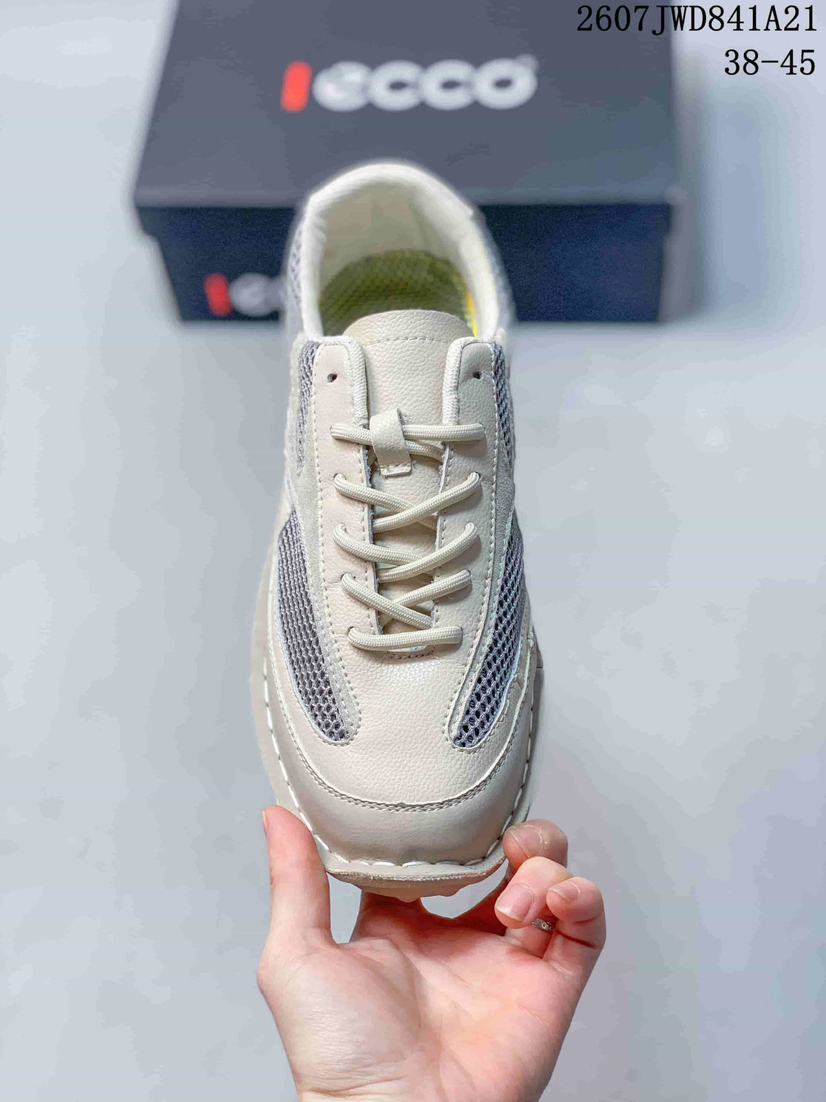 Top view showing the rounded toe, mesh side inserts, tongue, and white laces.