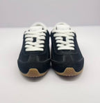 Front view of the pair showing white laces, black uppers, and gum-colored toe outsoles.