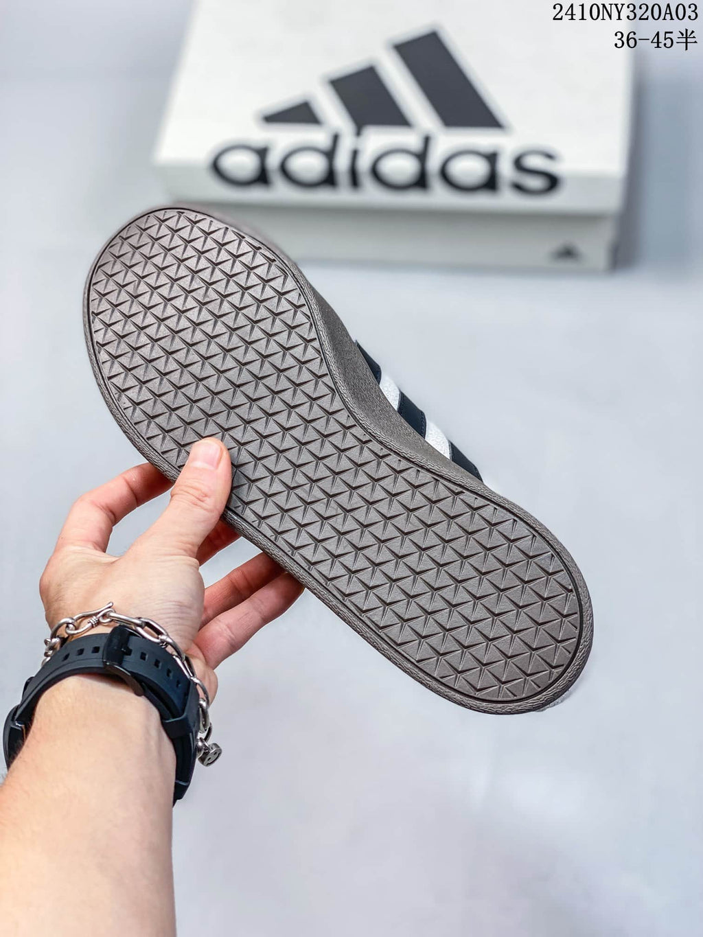Underside view showing the brown-colored outsole with a repeated geometric tread pattern.