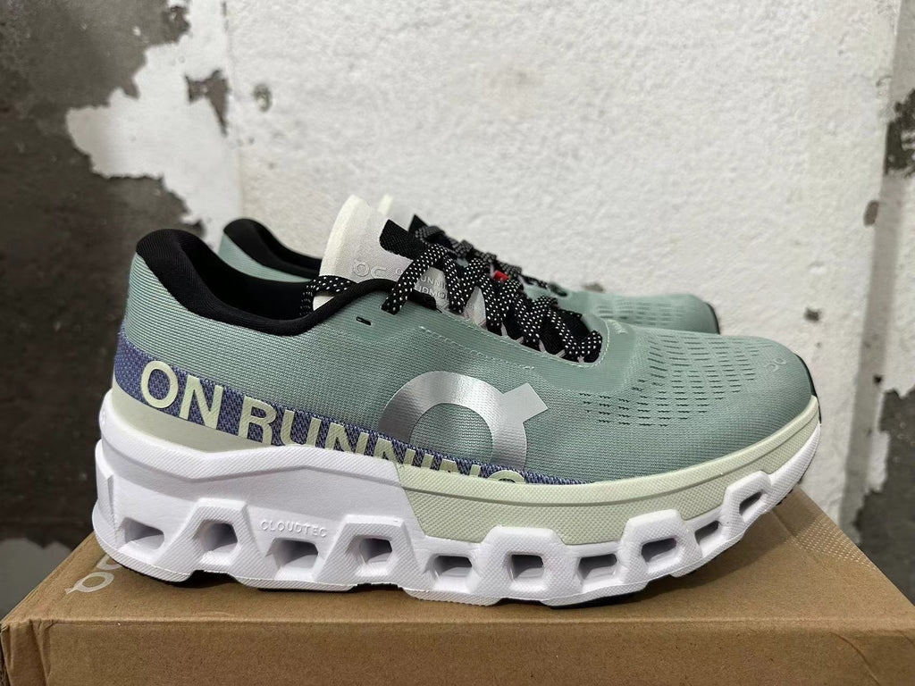 Side view showing the On Running branding, purple heel band and sculpted white sole.