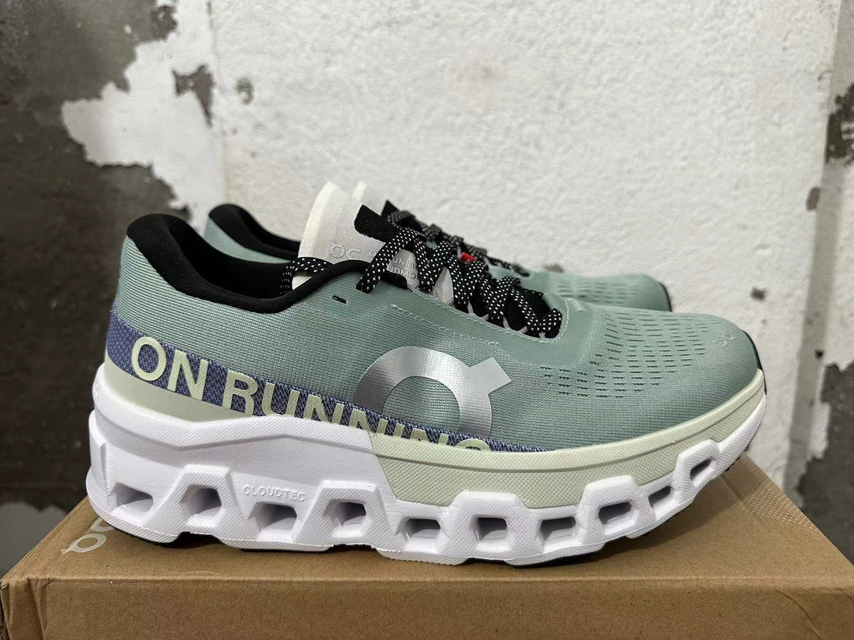 Side view showing the On Running branding, purple heel band and sculpted white sole.
