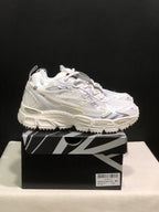 Side view of a white Off-White Be Right Back sneaker with layered panels, lace-up closure, and chunky outsole.