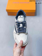 Top view showing the perforated white toe box, navy laces, and branded tongue.