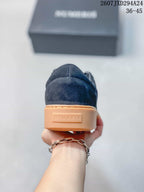 Rear view of the sneaker showing Numeris branding on the gum-colored heel section.