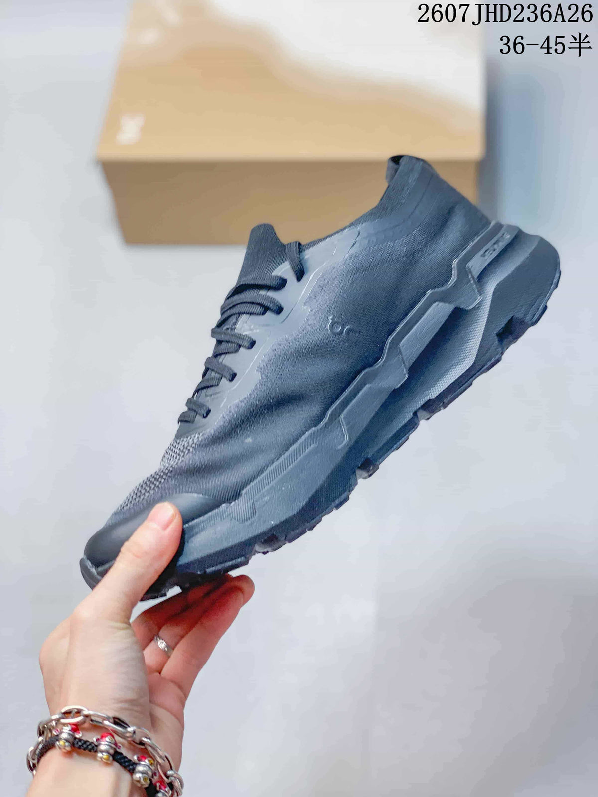 Side profile of a dark gray On trail running shoe showing the layered upper and rugged segmented sole; overlay text shows 2607JHD236A26 and 36–45.5.