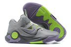 Gray Nike KD basketball shoes with lavender and bright green accents.