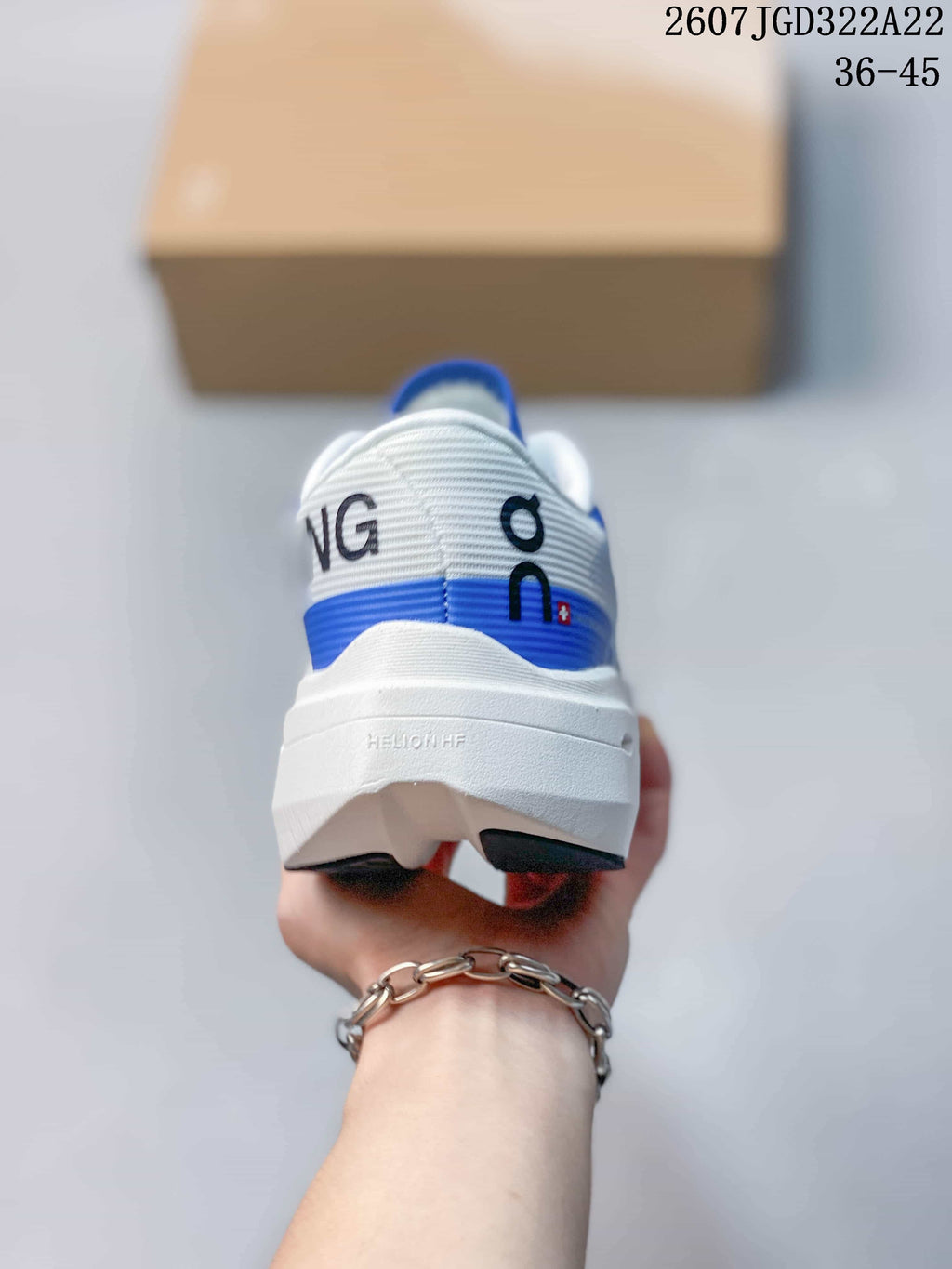 Rear view of the shoe showing the white heel, blue horizontal accent and On branding.