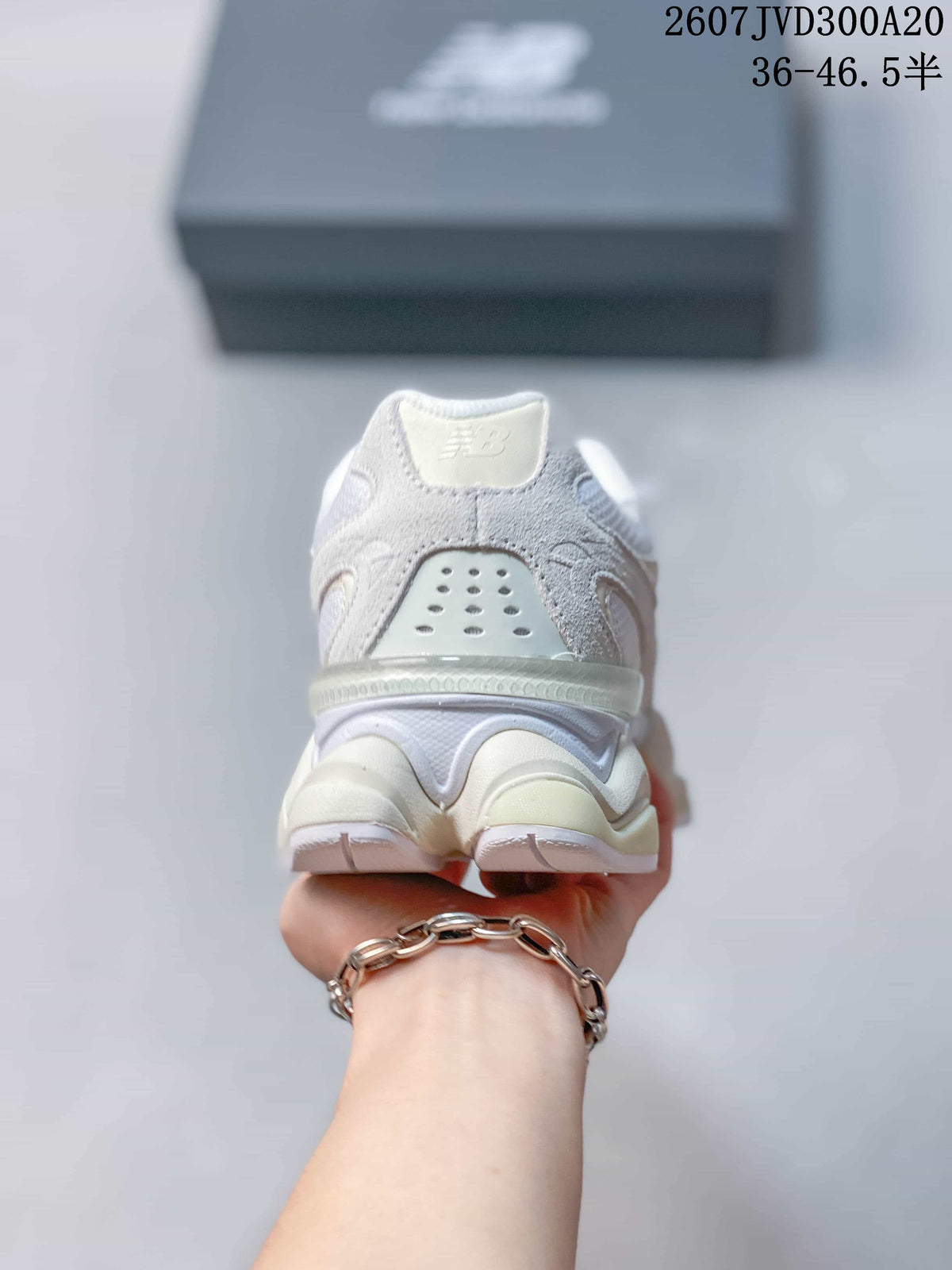 Rear view showing the padded heel area, perforated heel panel and layered outsole.
