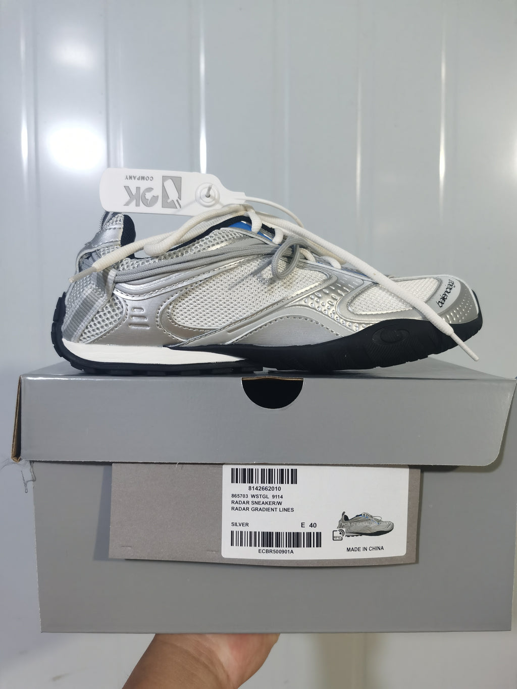 Silver Balenciaga Radar sneaker displayed on its box; the visible label identifies model 9114, the Radar sneaker name, silver color, and EU size 40.