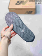 Close-up of the dark textured outsole showing its dotted tread pattern and molded branding.