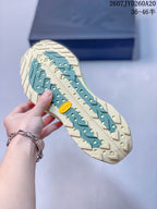 Close-up of the trail sneaker outsole showing a lugged tread pattern and visible Vibram mark.